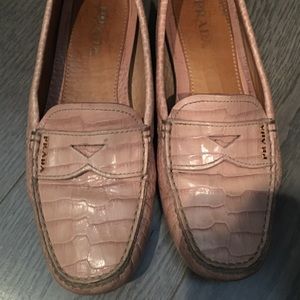 Prada loafers.